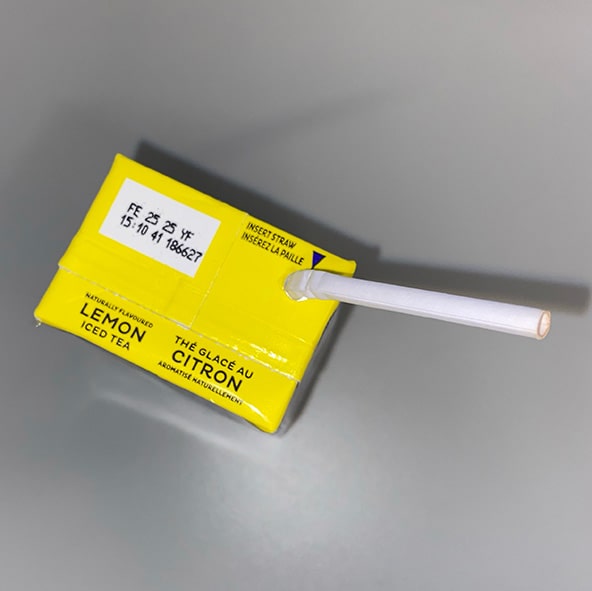 Nestea carton with a straw inserted on top